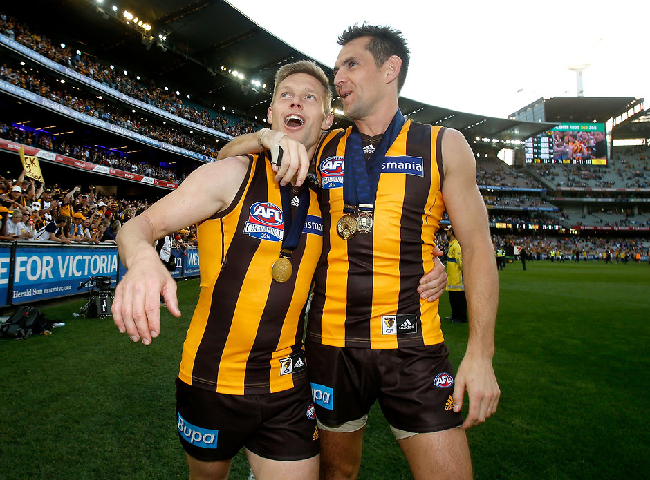 AFL 2014 Toyota Grand Final - Sydney v Hawthorn Luke Hodge of the Hawks and Sam Mitchell of the Hawks celebrate during the 2014 Toyota AFL Grand Final match between the Sydney Swans and the Hawthorn Hawks at the MCG, Melbourne on September 27, 2014. (Photo: Justine Walker/AFL Media)